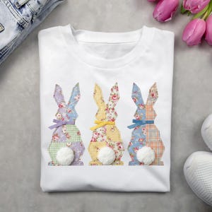 May include: A set of three ceramic mugs with a speckled, matte finish in cream, light grey, and dark grey. Each mug has a simple, minimalist design, suitable for coffee or tea.