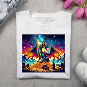May include: A white t-shirt with a colorful graphic print of a dragon guarding a pile of gold coins. The dragon has a green body, red wings, and a blue head. The background is a starry night sky with a sunset.