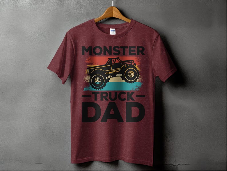 a red monster truck dad shirt hanging on a wall