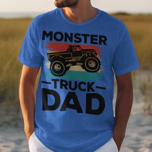 a man wearing a monster truck dad t - shirt