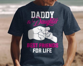 May include: A navy blue t-shirt with a white graphic that says "Daddy & Daughter Best Friends For Life". The graphic features a cartoon image of a father and daughter holding hands.