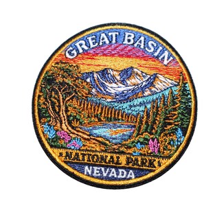 May include: Embroidered patch featuring a scenic landscape of Great Basin National Park in Nevada. The design includes mountains, a lake, and trees, with the text "GREAT BASIN NATIONAL PARK NEVADA" in a circular border.