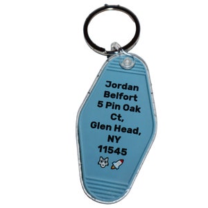 May include: Blue motel key chain with the text "Jordan Belfort 5 Pin Oak Ct, Glen Head, NY 11545" and a rocket and wolf emoji.