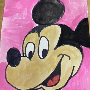 May include: A hand-drawn illustration of Mickey Mouse on a pink background. Mickey Mouse is drawn in black and brown with a big smile and large eyes.