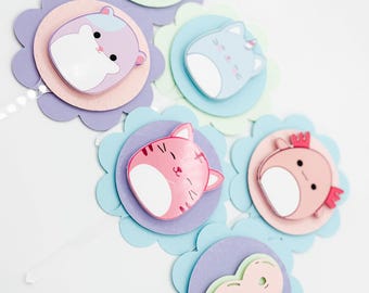 May include: Six pastel-colored cupcake toppers with different animal designs. The toppers feature a pink cat, a blue cat, a pink hamster, a pink and white butterfly, a pink and white dragon, and a pink number eight.