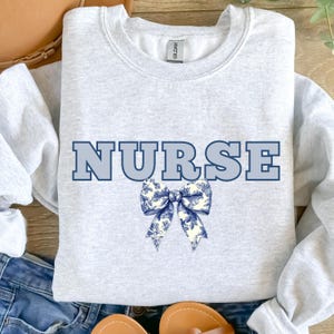 Toile De Jouy Nurse Bow Sweatshirt, Floral Nurse Hoodie, Coquette Nurse Shirt, Gift For Nurse, Nurse Ribbon Hoodie, Registered Nurse Shirt