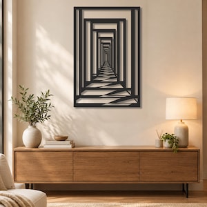 May include: A rectangular black metal wall art piece featuring a series of nested, concentric rectangular frames that create a deep, linear perspective effect, resembling a long corridor or tunnel receding into a distant vanishing point.