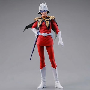 以下が含まれることがあります： 赤い制服に白いブーツと手袋を身につけたキャラクターの精巧なフィギュア。白いヘルメットをかぶり、黒いマントを羽織っています。紫色の剣が横に持たれています。金色の肩章と白いベルトが付いています。