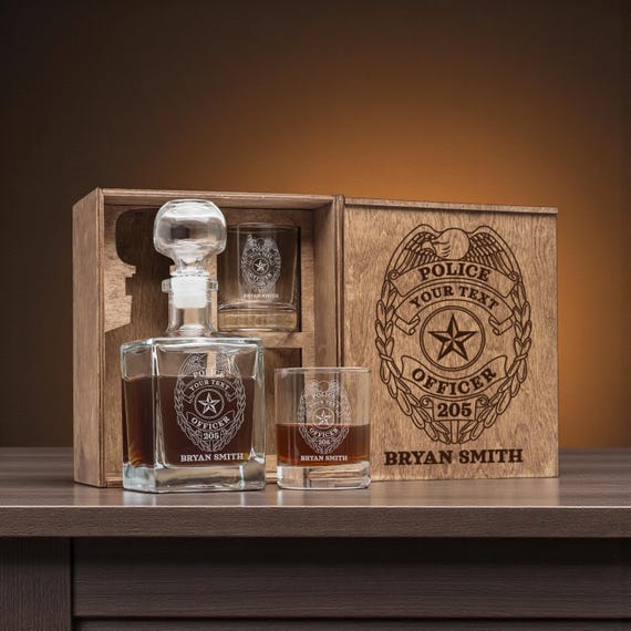 Occupation-specific engraved barware in a wooden box for police officers — tightly targeted niche personalization that genuinely solves the 'what do I get them' retirement gift problem.