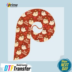 May include: A DTF transfer featuring a stylized letter "P" with a repeating pattern of cartoon ghosts wearing baseball caps and the text "Red October." The design is set against a reddish-brown background with autumn leaves.