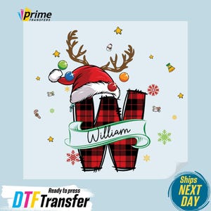 May include: A Christmas-themed design featuring a red and black plaid letter "W" with a Santa hat and reindeer antlers. The name "William" is displayed on a banner. Festive elements like snowflakes and stars surround the design.