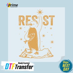 May include: A gold penguin with a fish in its hand, standing on a piece of ice with the word "RESIST" above it. The background is light blue with a star pattern.