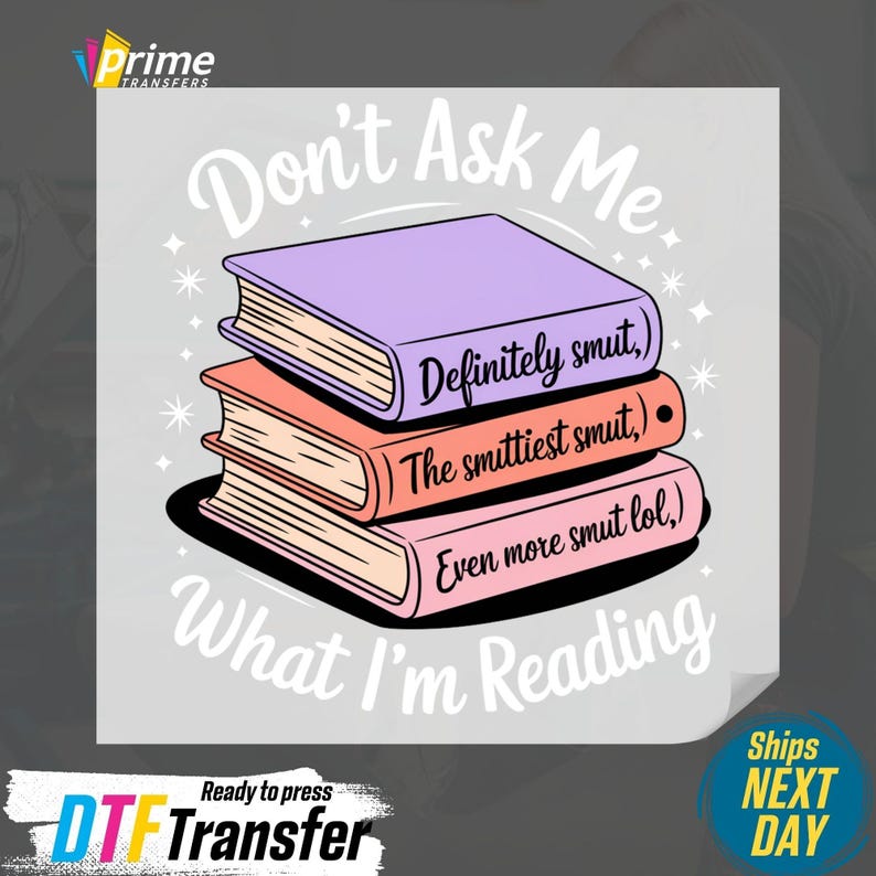 May include: A graphic featuring a stack of three books with the text "Don't Ask Me What I'm Reading." The books are purple, coral, and pink, with the titles "Definitely smut," "The smuttiest smut," and "Even more smut lol."
