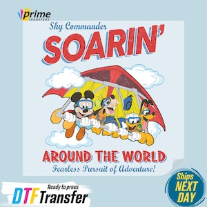 May include: A light blue graphic featuring Mickey Mouse, Goofy, Pluto, and Donald Duck in a red and yellow hang glider. Text reads "Sky Commander SOARIN'" and "AROUND THE WORLD Fearless Pursuit of Adventure!" DTF Transfer.