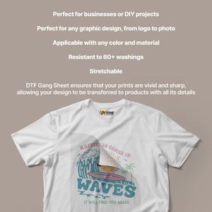 May include: White t-shirt with a colorful graphic design featuring the text "Happiness Comes in Waves" and a surfing bird. The shirt also has the text "It Will Find You Again". The shirt is made of a soft, comfortable material.