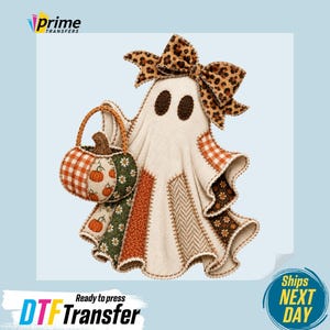 May include: A ghost graphic featuring a leopard print bow, holding a pumpkin-shaped basket. The ghost is decorated with various fabric-like patterns including orange gingham, green floral, and herringbone textures in shades of cream and brown.