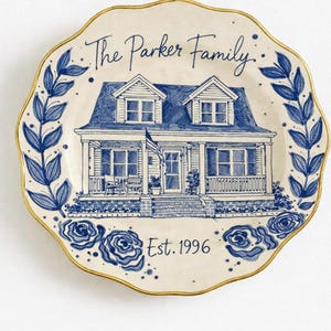 Hand painted house portrait on ceramic plate, custom home illustration, personalized birthday memory giftCustom housewarming plate with hand painted home, blue and white porcelain, unique family keepsake
Personalized ceramic plate with home painting, architectural portrait, custom address gift idea
	Hand painted home on decorative plate, custom real house illustration, sentimental birthday present