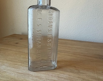 Vintage Sloan's Liniment Bottle: Embossed Glass Apothecary Decor