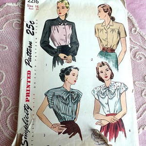 May include: Vintage Simplicity printed sewing pattern featuring illustrations of four different blouse designs. The pattern includes the text "2216 Size 16 Bust 34" and "25c". The cover art showcases women's fashion from the mid-20th century.
