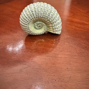 May include: A rustic wooden sign with the text "Welcome to our home" in white lettering. The sign features a distressed finish and a simple, inviting design, perfect for a front porch or entryway.