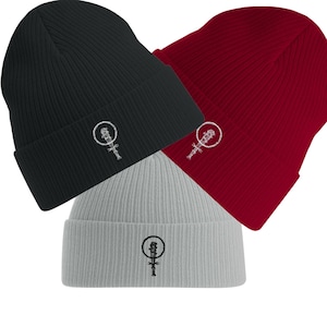 May include: Three knitted beanies in black, red and grey with a white embroidered design of barbed wire wrapped around a baseball bat.