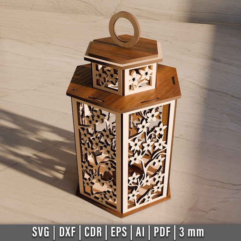 May include: A wooden lantern with intricate floral cutouts. The lantern has a hexagonal shape with a handle on top. The design includes a smaller top section with similar cutouts. The wood has a warm, natural finish. The bottom of the image includes the text: SVG | DXF | CDR | EPS | AI | PDF | 3 mm.