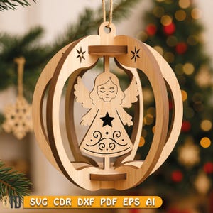May include: Wooden Christmas ornament featuring a laser-cut angel design. The ornament has a spherical shape with a layered construction, showcasing an angel with a star and decorative patterns. The ornament is suspended by a natural twine. The text "SVG CDR DXF PDF EPS AI" is at the bottom.