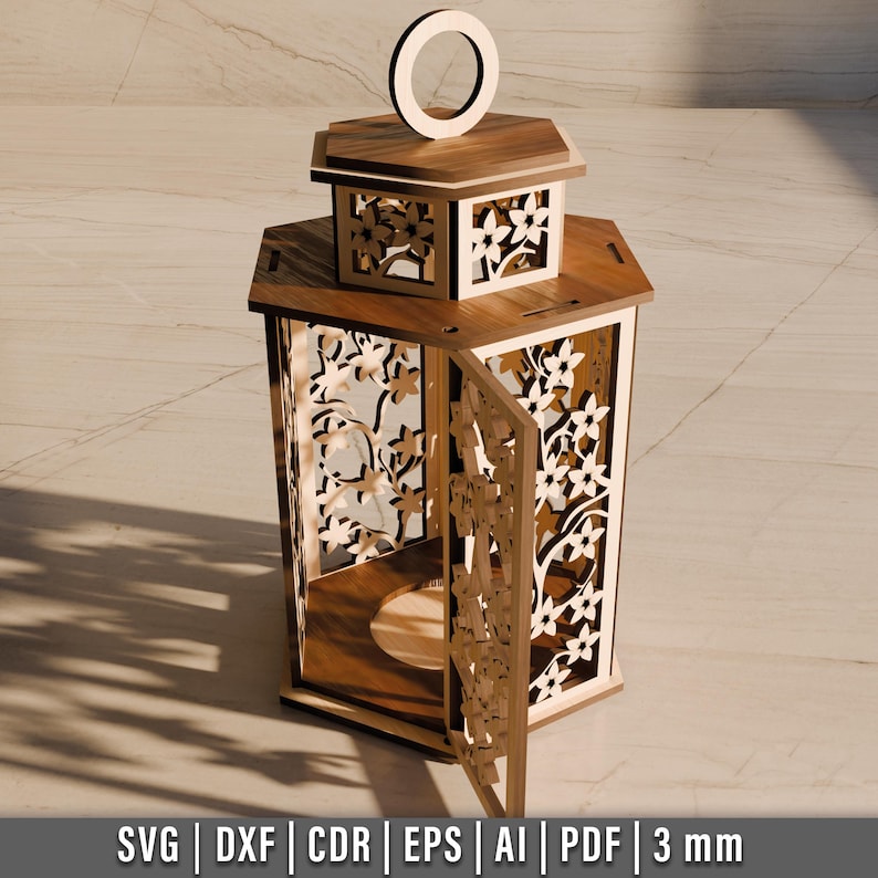 May include: A wooden lantern with intricate floral cutouts and a hinged door. The lantern features a handle at the top and is made of light brown wood. The design includes the text "SVG | DXF | CDR | EPS | AI | PDF | 3 mm".