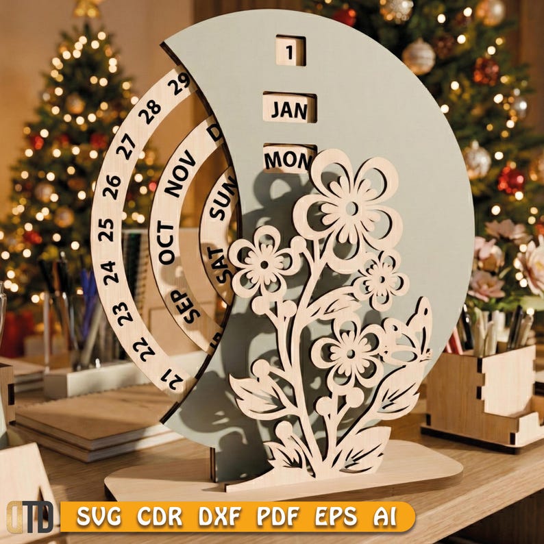 May include: A wooden perpetual calendar with a floral design. The calendar features rotating rings for the date and month, with the month of January and the day 1 visible. The design includes laser-cut flowers and leaves. The base is made of light-colored wood.