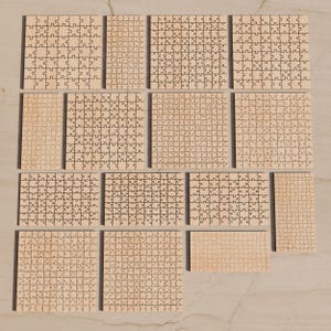 May include: A collection of fifteen light-colored wooden jigsaw puzzles of varying rectangular and square sizes, each featuring a distinct interlocking piece pattern laser-cut into the surface, arranged in a grid-like layout.