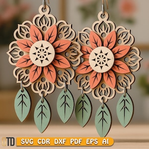 May include: Wooden earrings featuring a layered floral design with peach and natural wood tones. Each earring has a central flower with a starburst center, surrounded by peach petals and green leaf pendants. The earrings are suspended from silver-colored hooks. The text "SVG CDR DXF PDF EPS AI" is at the bottom.