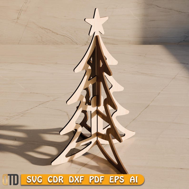 May include: A wooden Christmas tree decoration with a star on top. The tree is made of light and dark brown wood, with a layered design. The base of the tree is visible, and the tree is standing upright. The image also contains the text "SVG CDR DXF PDF EPS AI".