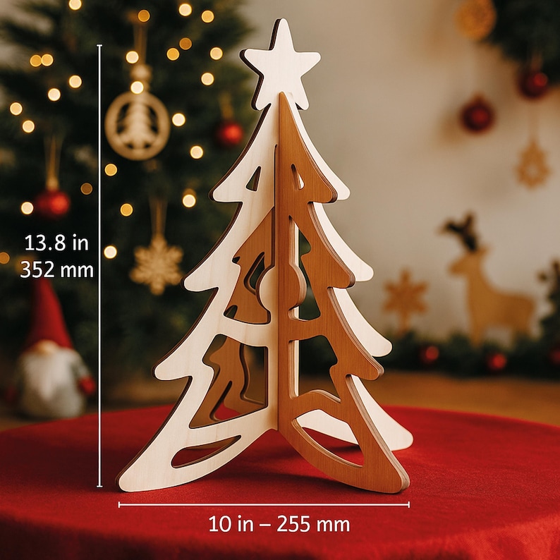 May include: A wooden Christmas tree decoration with a star on top. The tree is made of light and dark wood, measuring 13.8 inches (352 mm) tall and 10 inches (255 mm) wide. The tree is on a red surface, with Christmas decorations in the background.