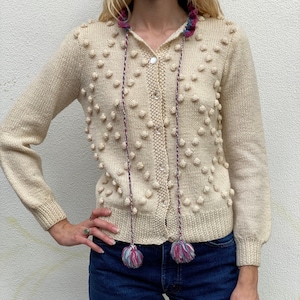 Vintage Knubby Cardigan Sweater / Popcorn Knit Sweater / Clear Plastic Buttons with Drawstring Neckline and Pom Moms