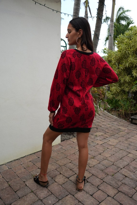Black dress with red sweater hot sale