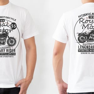 May include: White t-shirt featuring a black and white graphic of a motorcycle with the text "Royal Motor" and "Legendary Rider". The design includes the text "Authentic Motorcycle 1955" and "International Motorcycle Supply Co."