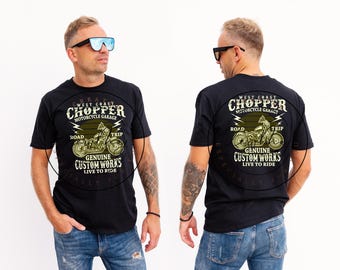 May include: Black t-shirt featuring a motorcycle graphic with the text "West Coast Chopper Motorcycle Garage." The design includes the words "Road Trip," "Genuine Custom Works," and "Live to Ride."