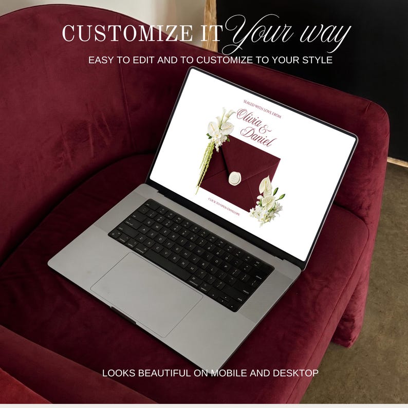May include: A silver laptop displaying a burgundy invitation design with white floral accents and the names "Olivia & Daniel." The laptop sits on a burgundy velvet chair. Text on the screen reads "Customize it Your way" and "Looks beautiful on mobile and desktop."