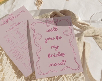 May include: A pink card with a decorative border and the text "will you be my brides maid?" in pink script.