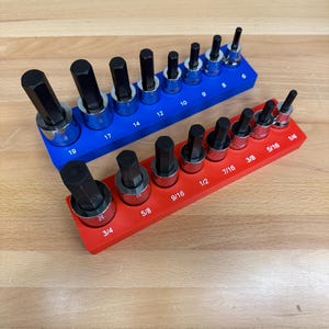 May include: Two sets of hex bit sockets in a blue and red holder. The blue holder has sizes 9, 10, 12, 14, 17, and 19. The red holder has sizes 1/4, 5/16, 3/8, 7/16, 1/2, 9/16, 5/8, and 3/4.