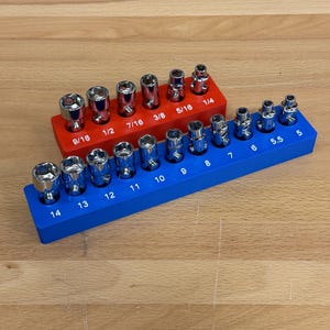 May include: Two socket sets with chrome sockets in red and blue holders. The red holder has sockets from 1/4 to 9/16 inch. The blue holder has sockets from 5 to 14 mm. The sockets are for mechanical work.