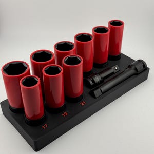 May include: A set of red impact sockets with black interiors, arranged on a black tray. The sockets are labeled with sizes 17, 19, and 21. Two black extension bars are also included in the set.