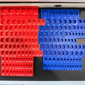 May include: A set of red and blue socket organizers with various sizes of sockets. The sockets are labeled with their sizes in fractions of an inch.