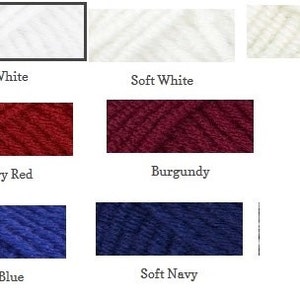 May include: A selection of yarn skeins in a range of colours. The palette includes white, soft white, Aran, cherry red, burgundy, royal blue, and soft navy. Each colour is labelled with its name.
