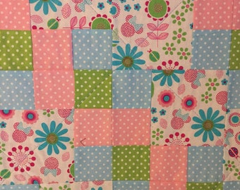 Pink and blue crib quilt