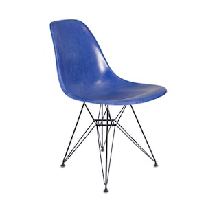 May include: A blue fiberglass chair with a black metal base. The chair has a distinctive mid-century modern design.