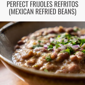 May include: A close-up of a bowl of refried beans, garnished with chopped cilantro and red onion. The text "PERFECT FRIJOLES REFRITOS (MEXICAN REFRIED BEANS)" is at the top. The bowl is beige and sits on a wooden surface.