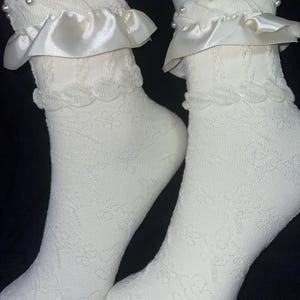 Princess ruffle sock   ruffle made of satin and sock made of knit/polyster. Pearls on trim and flower design through out-teen/adult one size