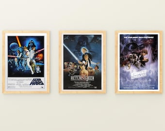May include: Three framed Star Wars movie posters. The posters feature vibrant artwork from the original trilogy. The first poster is for "Star Wars", the second for "Return of the Jedi", and the third for "The Empire Strikes Back". Each poster is in a light wood frame.
