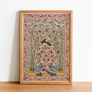 May include: A framed print of a traditional Indian artwork depicting a colorful floral design with birds and peacocks. The artwork is framed in a natural wood frame.